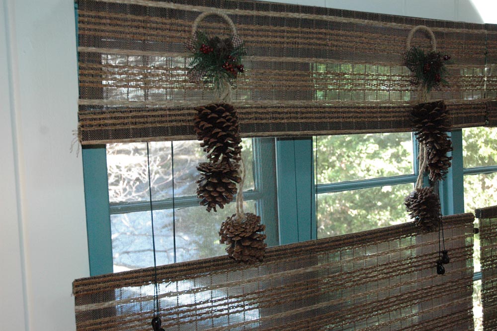 pine cones hanging from woven woods in master bedroom
