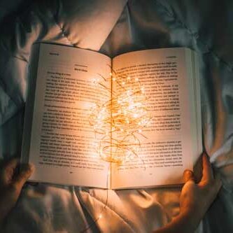 open book with Christmas lights